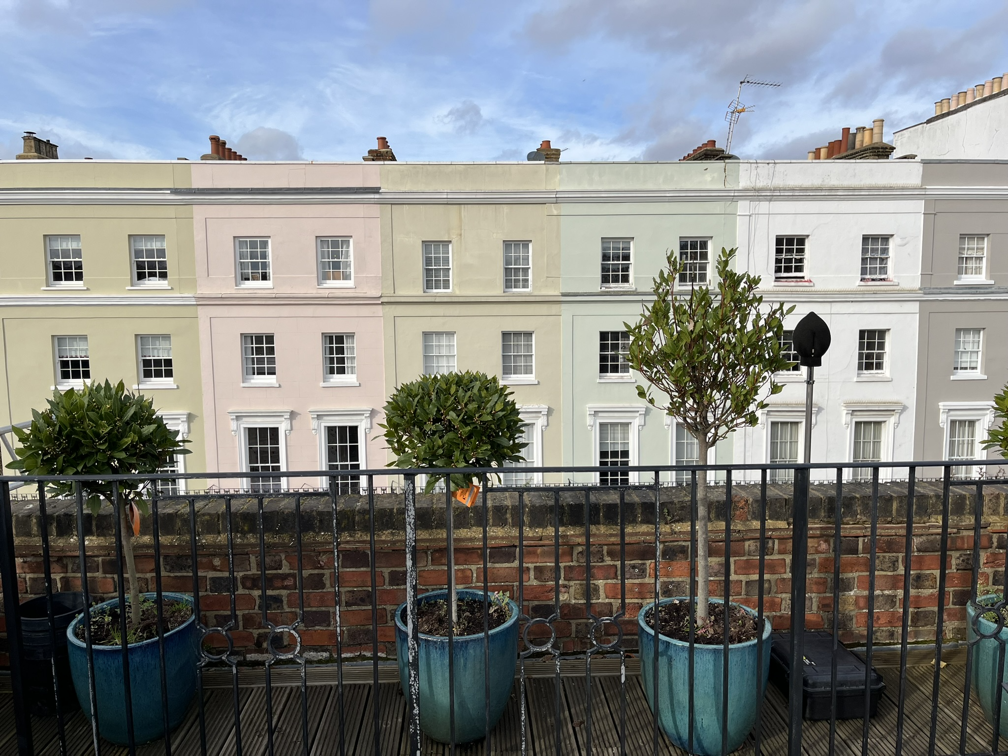 The sound level meter (SLM) on the roof terrace opposite painted buildings in Holland Park